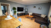 Moderne, großzügige Erdgeschosswohnung mit Terrasse, Kellerraum und Stellplatz - Wohnzimmer